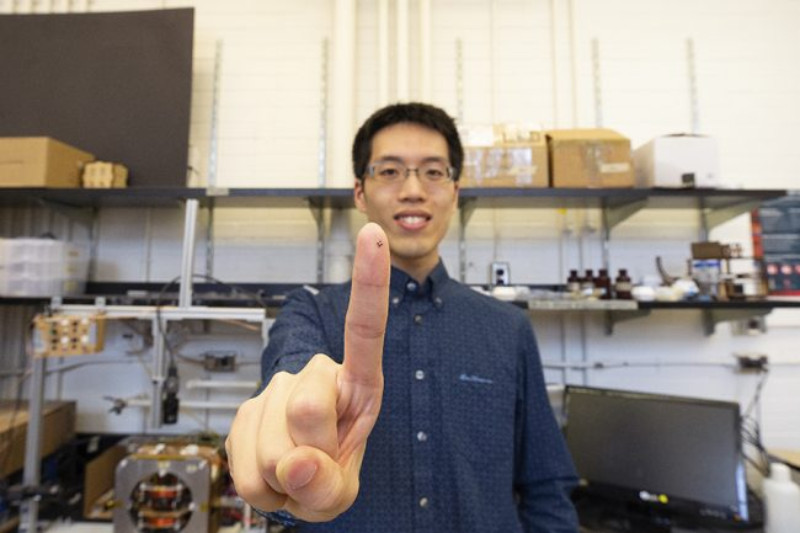 Tianqi Xu holds up a 3D printed magnetized medical robot